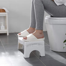 Compact white toilet squat stool with foldable and non-slip features.